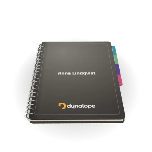The Dynabook: a dark A4 notebook with wire binding, coloured tabs and the Dynalope mark on the cover.